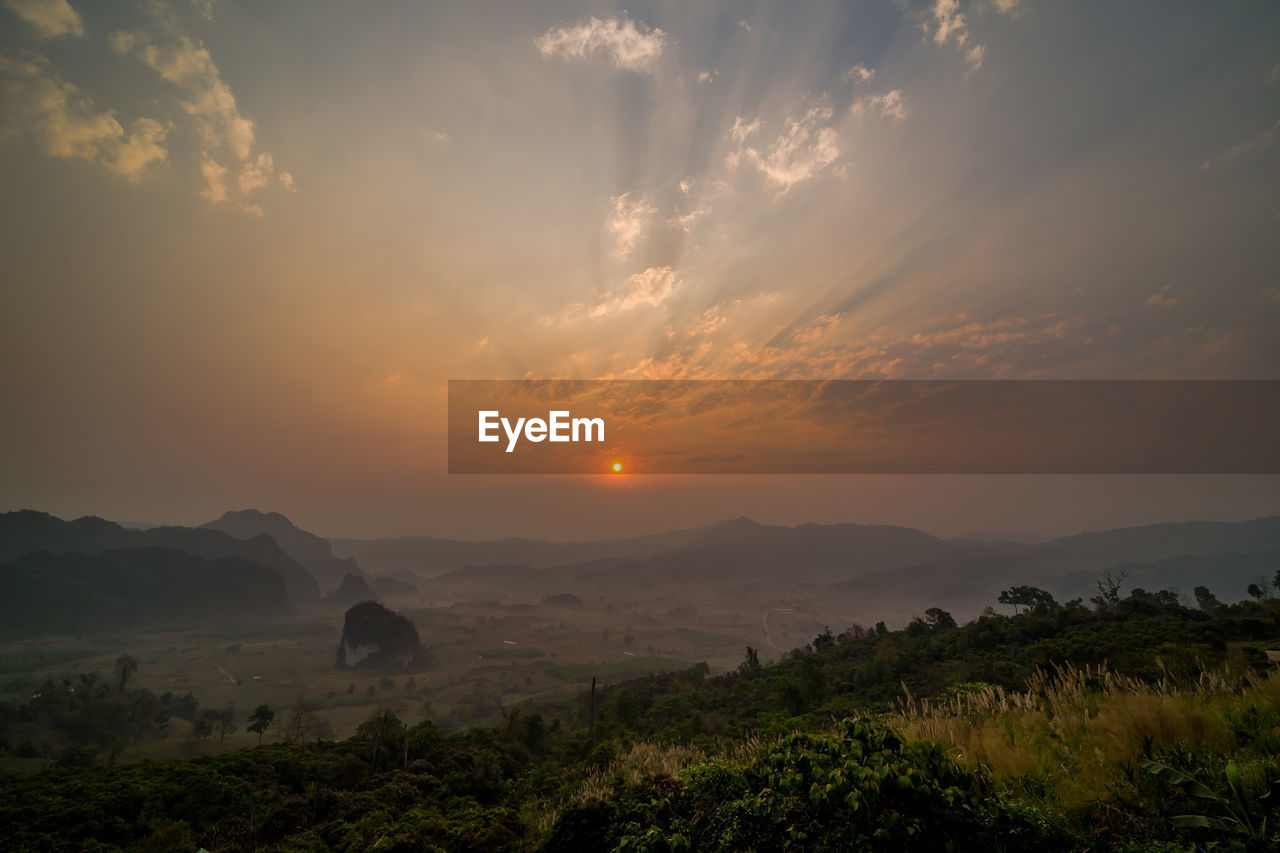 Scenic view of field against sky during sunset