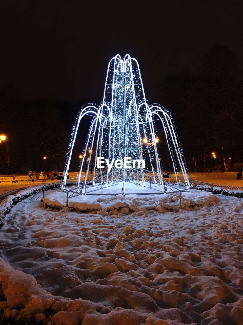 ILLUMINATED FERRIS WHEEL AT NIGHT DURING WINTER