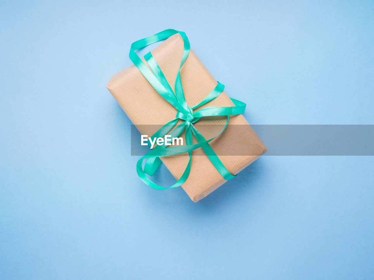 HIGH ANGLE VIEW OF UMBRELLA AGAINST BLUE BACKGROUND