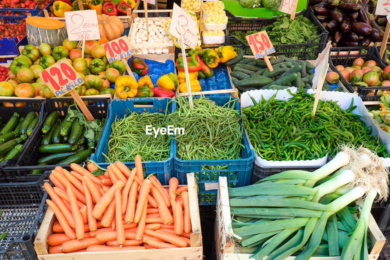 Nice selection of vegetables and salad for sale at a market in naples, italy