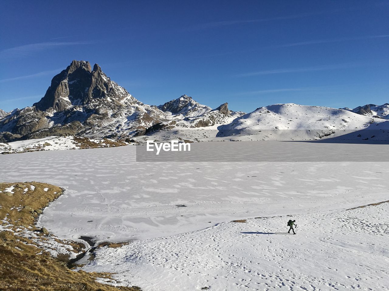 SNOWCAPPED MOUNTAINS AGAINST BLUE SKY