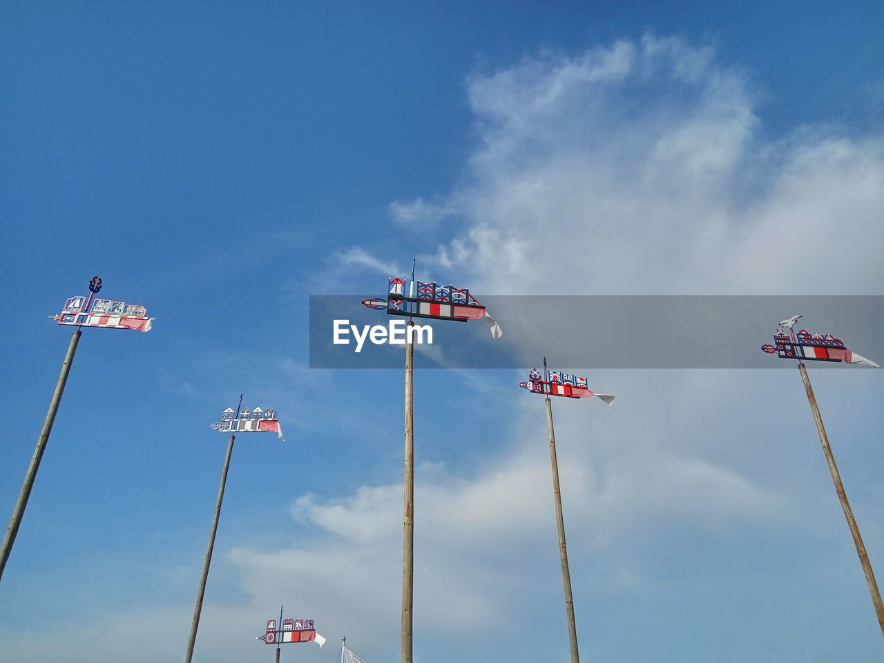 LOW ANGLE VIEW OF FLAG AGAINST BLUE SKY