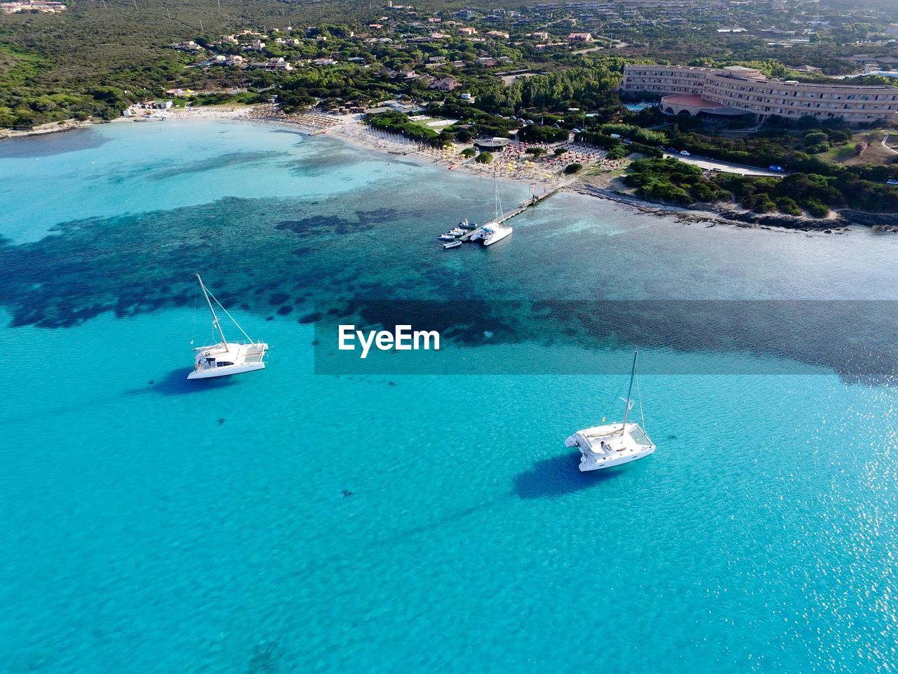 High angle view of sailboats sailing in sea