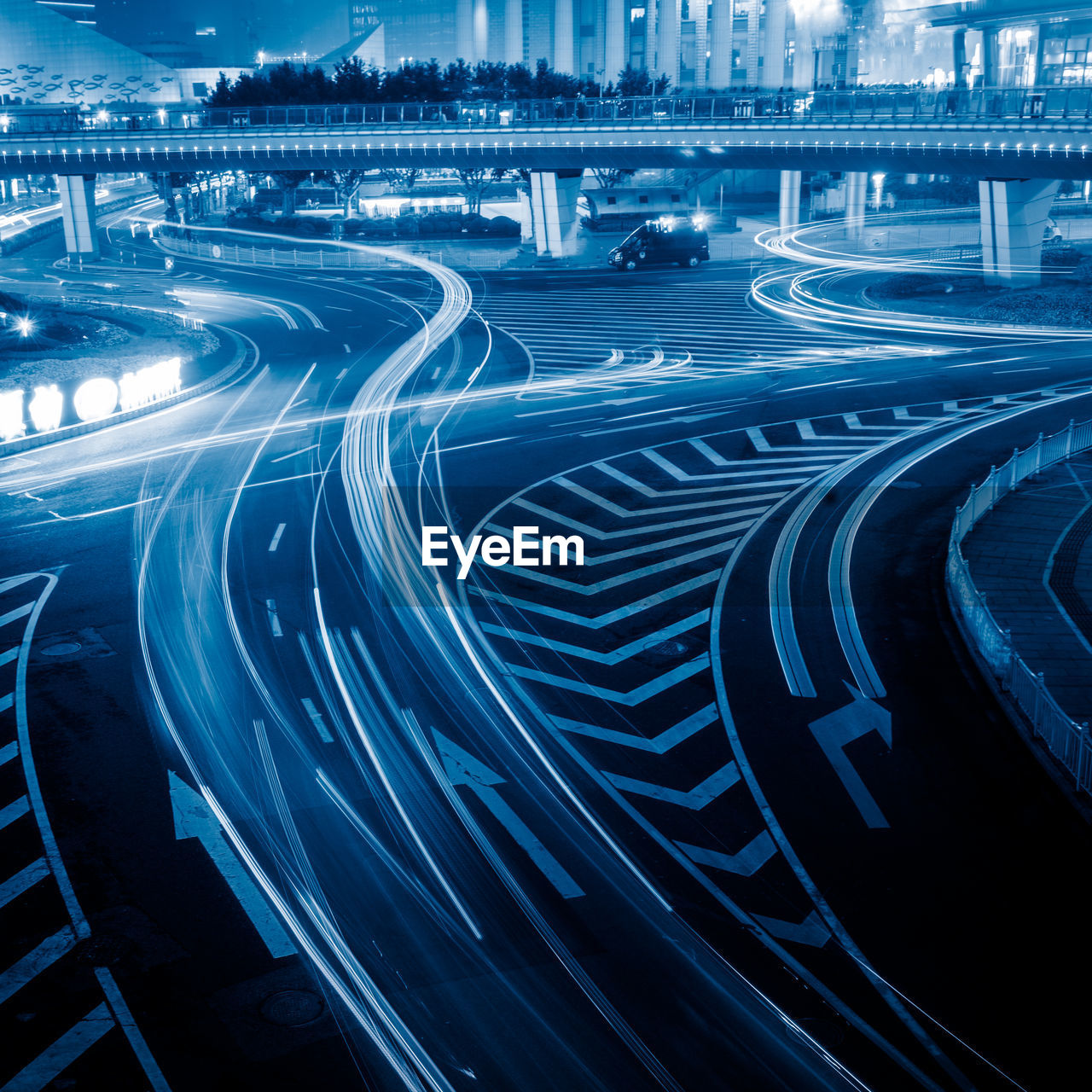 High angle view of light trails on road in city at night