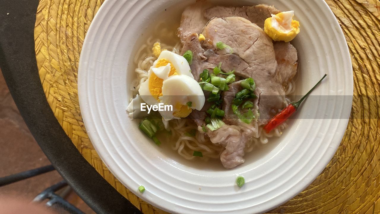 food and drink, food, healthy eating, meat, vegetable, freshness, wellbeing, dish, asian food, no people, indoors, meal, bowl, high angle view, cuisine, soup, table, kitchen utensil, directly above, egg, close-up, still life, beef, eating utensil, pork, produce