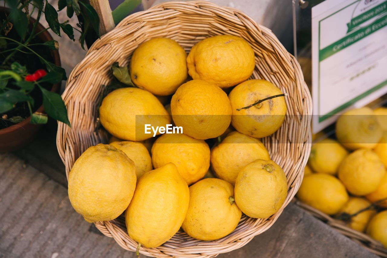 Close-up of lemons in basket at market