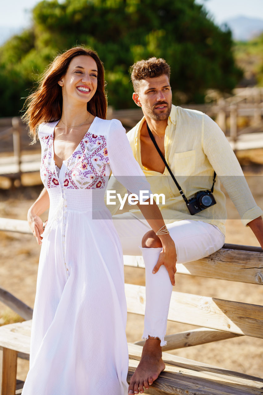 Young couple looking away outdoors