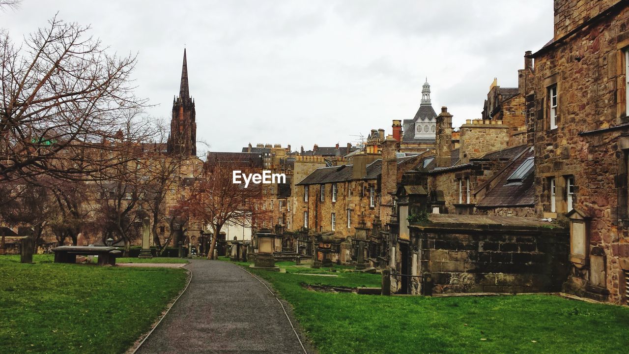 Panoramic view of buildings and houses against sky in city
