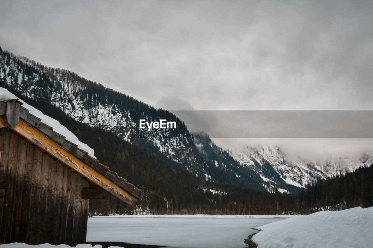 SNOW COVERED LANDSCAPE AGAINST SKY