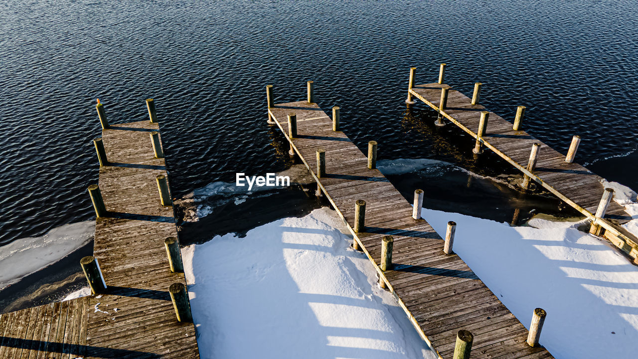 Snow and ice formed on the waters edge at the boat landing