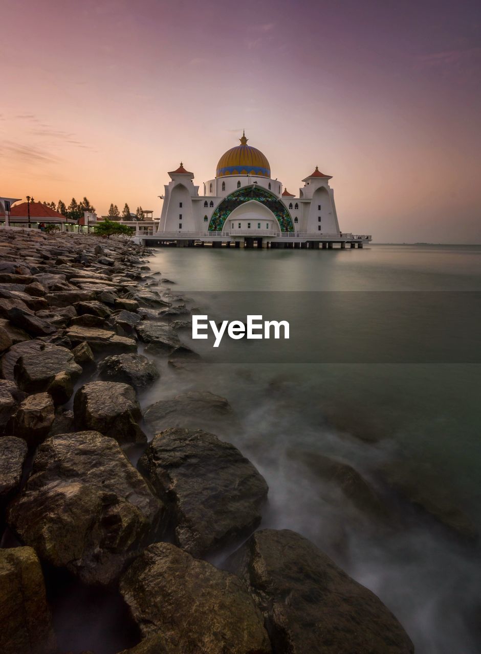 VIEW OF TEMPLE BUILDING AT SUNSET