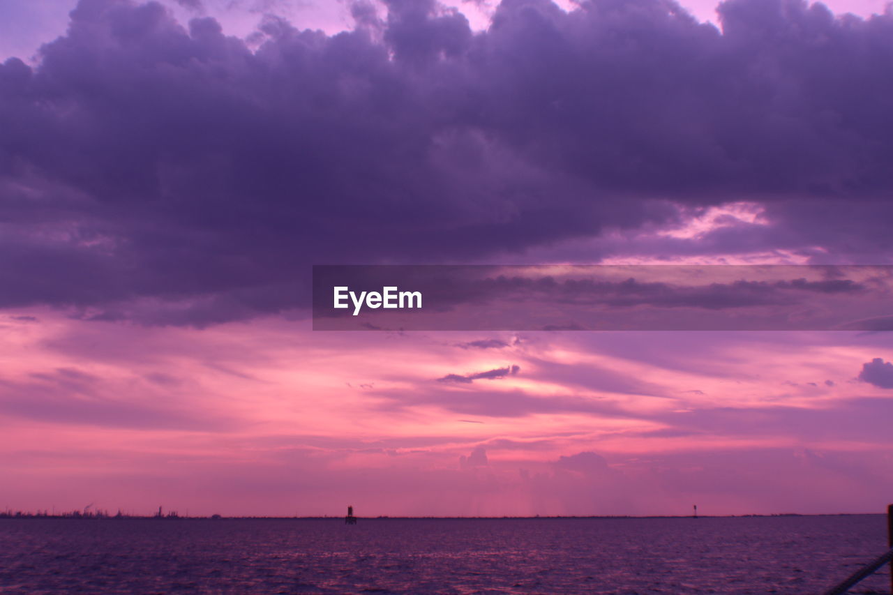 Scenic view of sea against sky at sunset