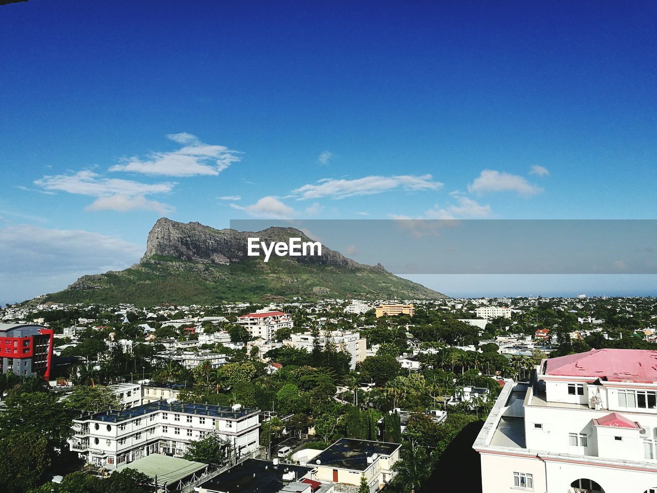 PANORAMIC VIEW OF RESIDENTIAL DISTRICT AGAINST SKY