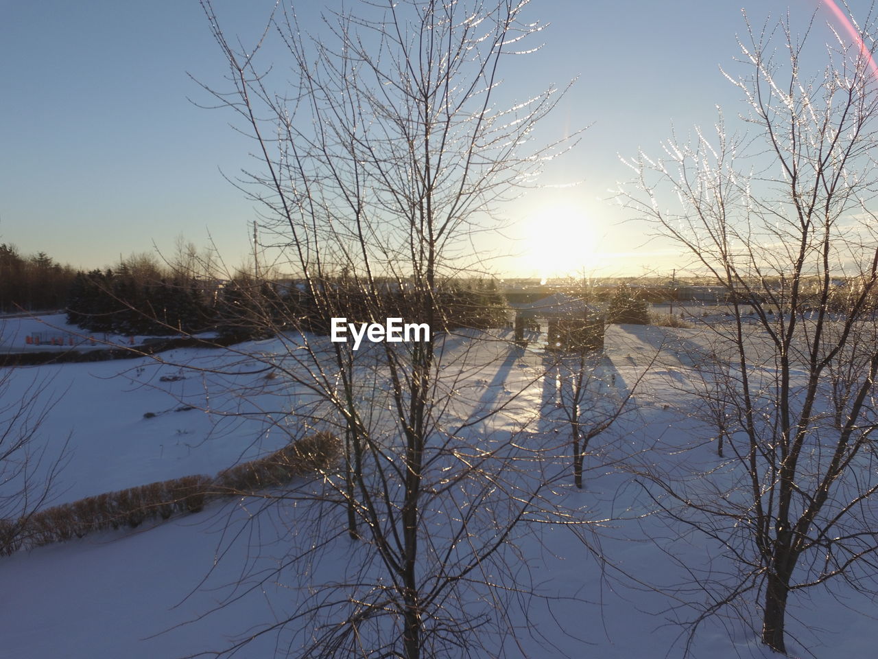 Scenic view of lake against sky during winter