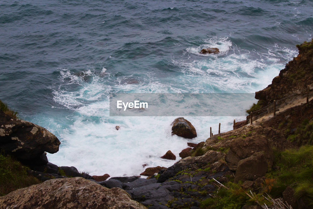 High angle view of rocks in sea