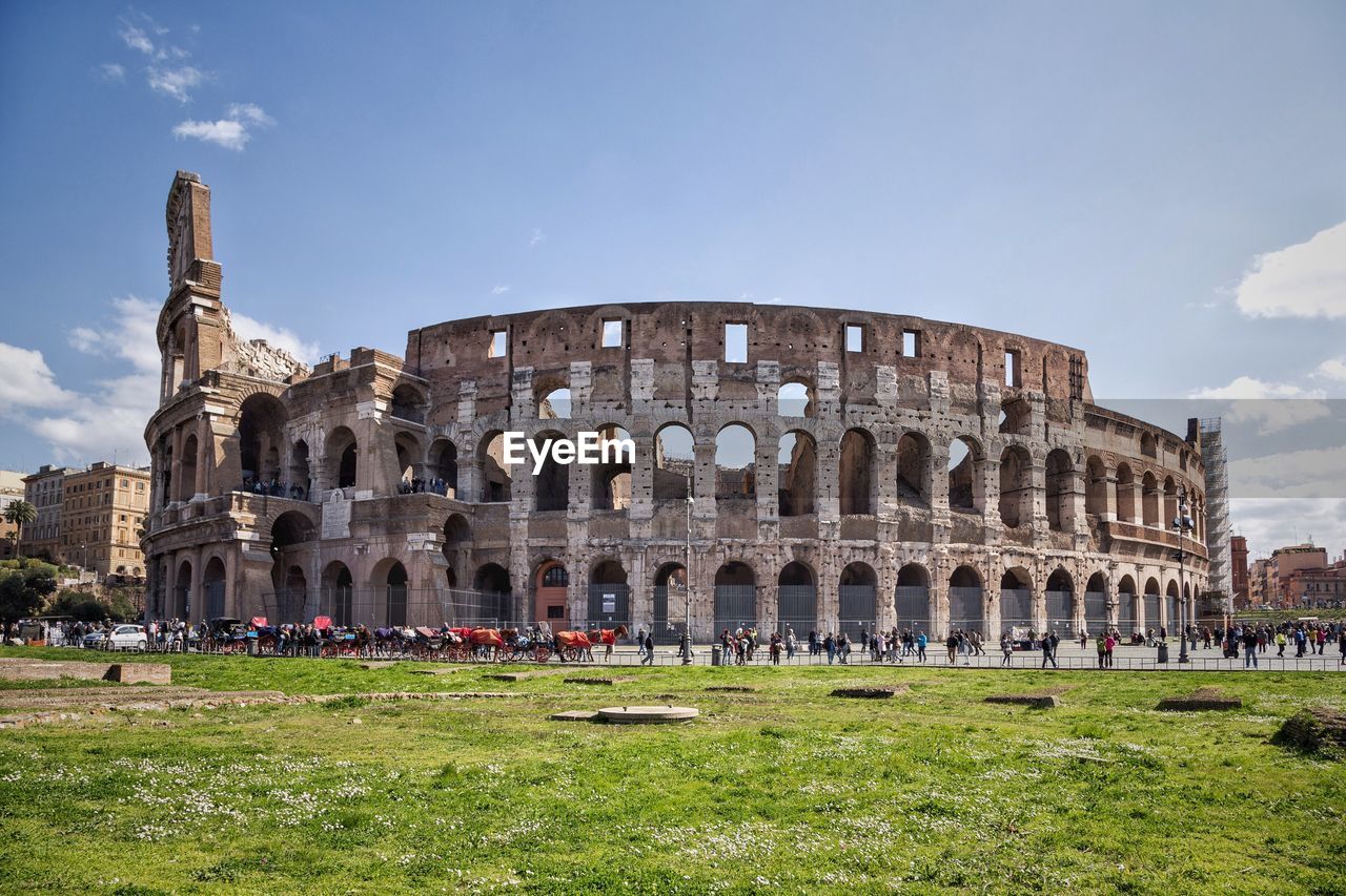 People outside coliseum in city