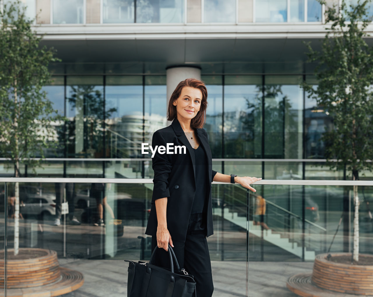 portrait of businesswoman standing in city