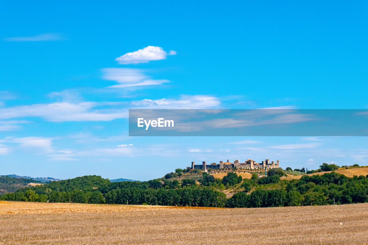 Landscape with skyline of little town of monteriggioni, tuscany, along via francigena