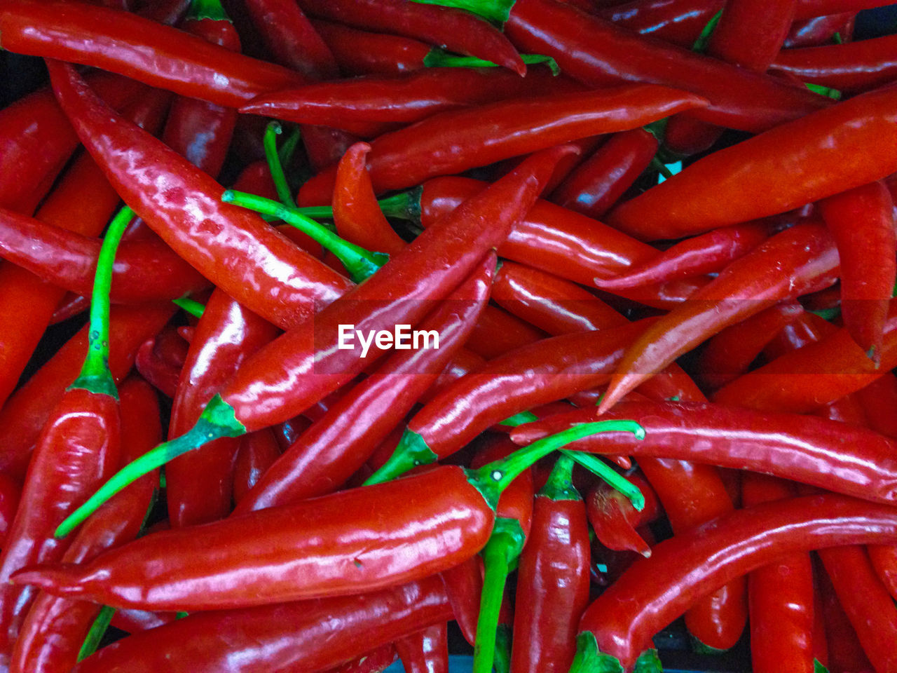 Full frame shot of red chili peppers for sale at market stall