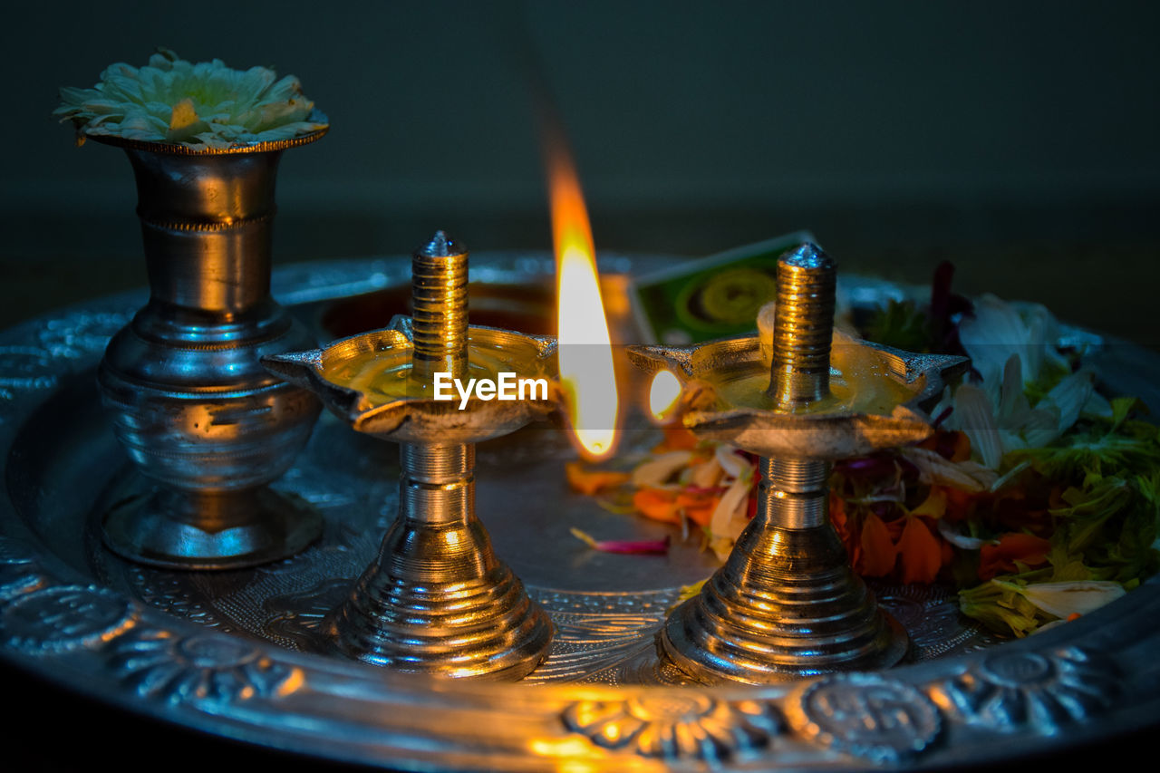 Close-up of diya in temple