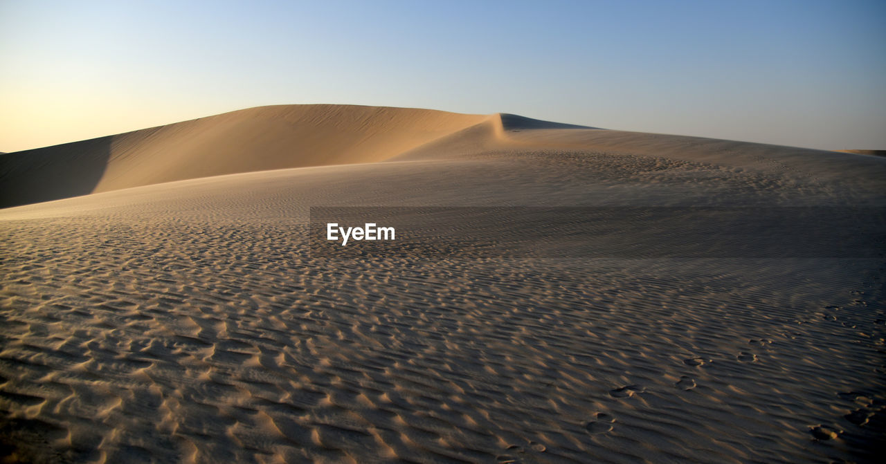 SCENIC VIEW OF DESERT AGAINST SKY