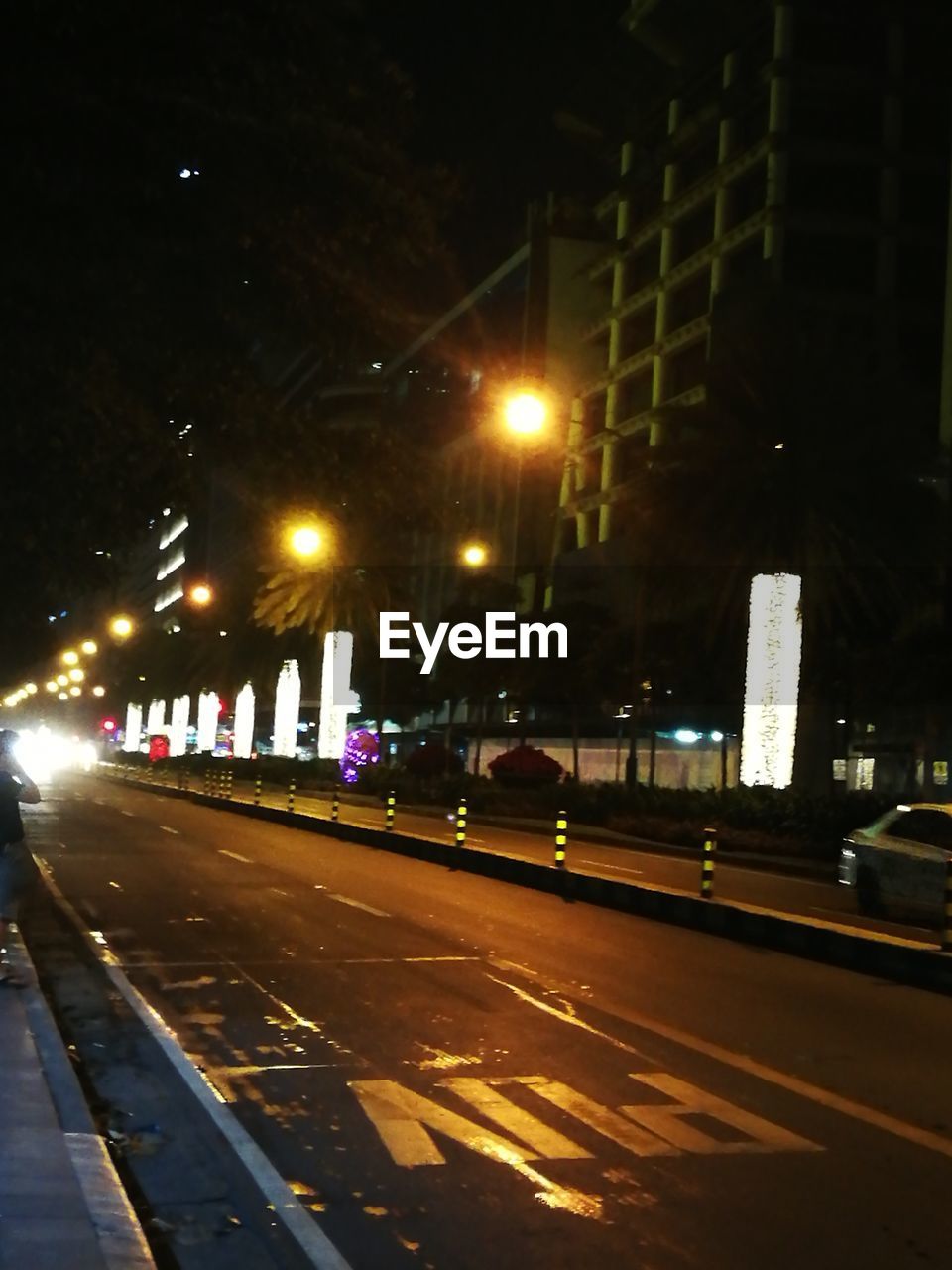 CARS ON STREET AT NIGHT