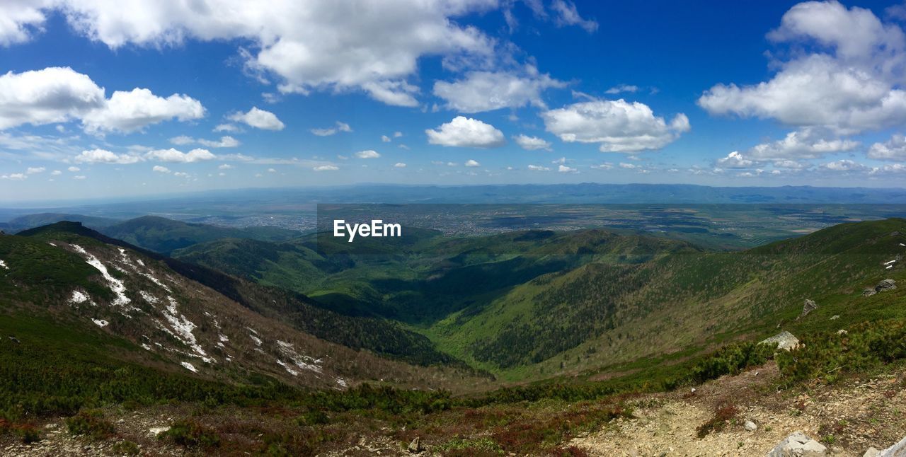 SCENIC VIEW OF VALLEY AGAINST SKY