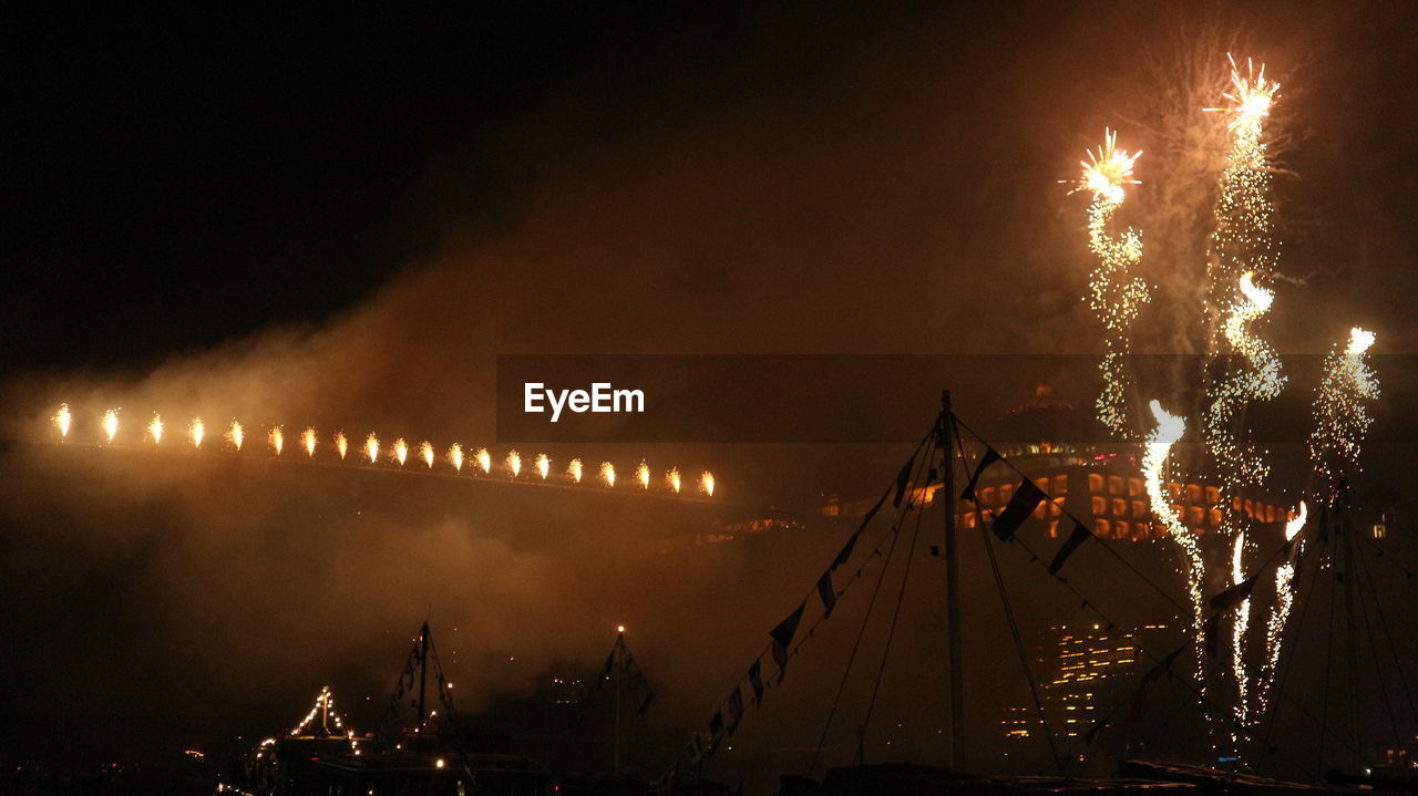 FIREWORK DISPLAY IN SKY AT NIGHT