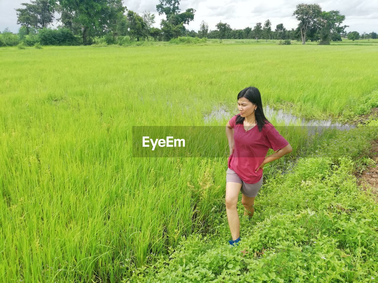 WOMAN STANDING ON FIELD