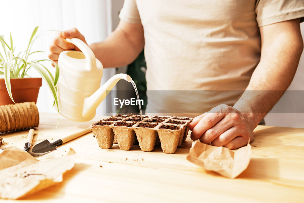 midsection of woman preparing food on table