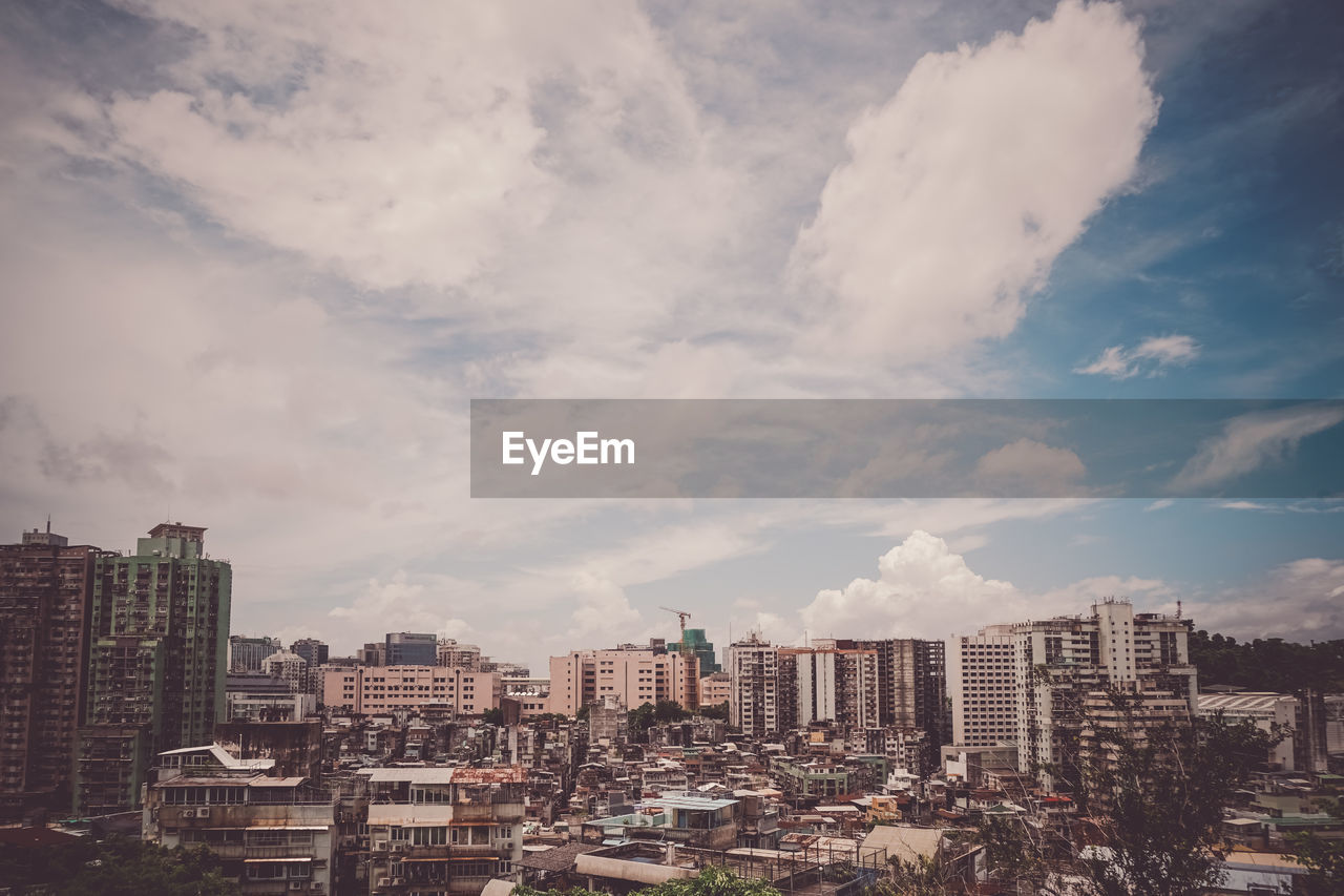 buildings in city against sky