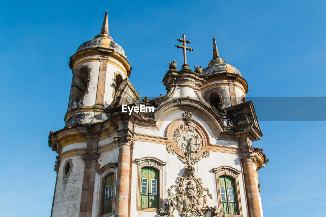 Low angle view of st francis of assisi church against clear blue sky