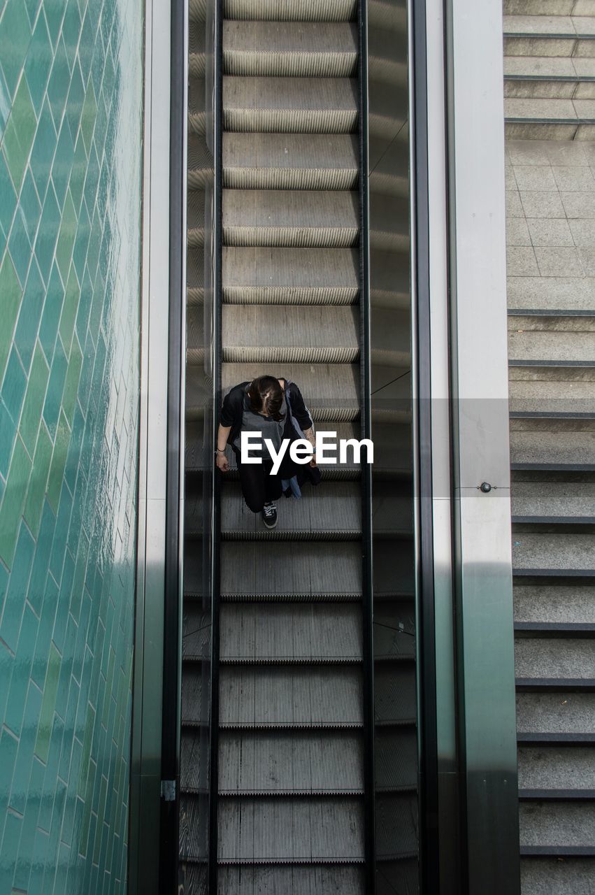 Directly above shot of woman on escalator