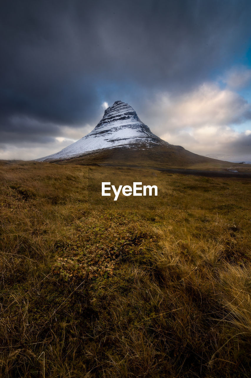 Scenic view of the kirkjufell mountain in grundarfjordur in the snaefelsness peninsula, iceland