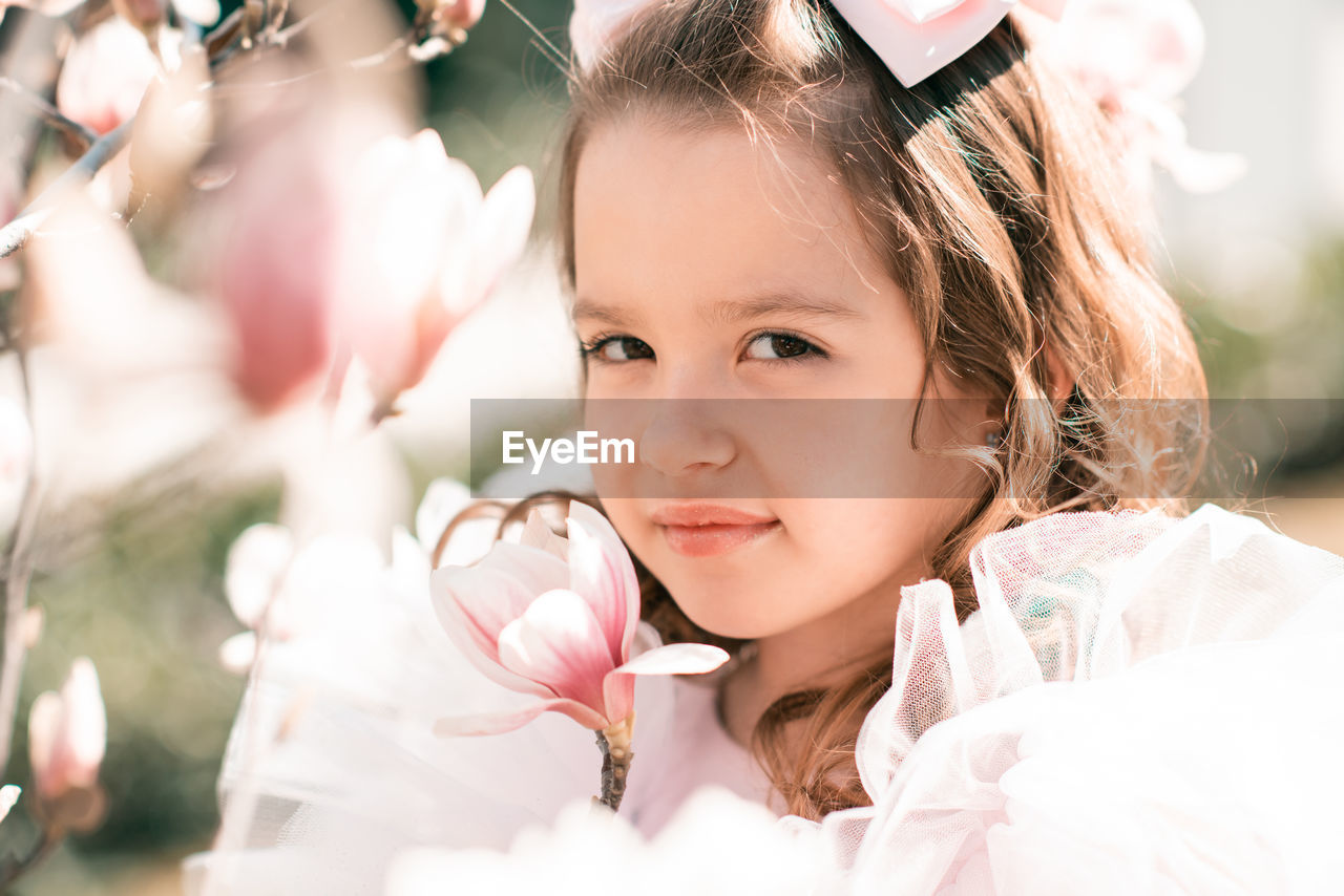 Portrait of girl standing in park