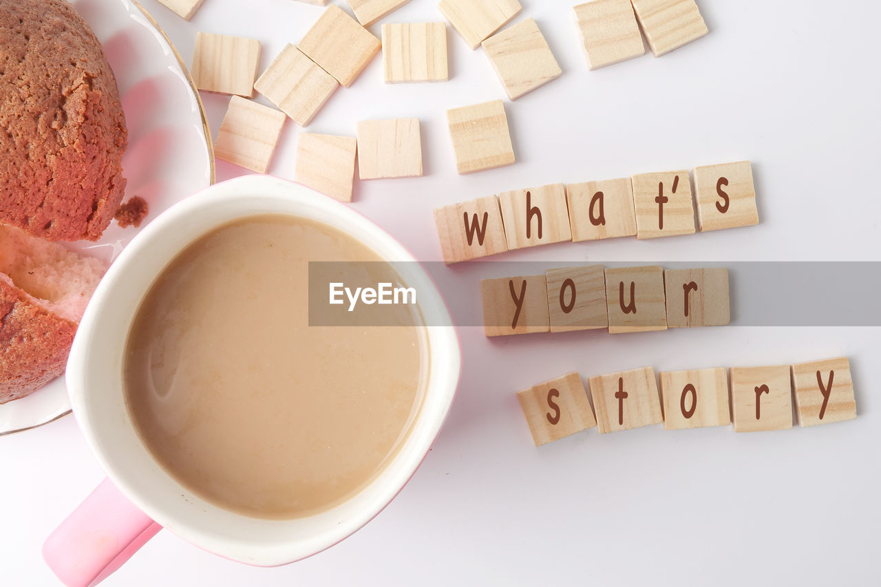 HIGH ANGLE VIEW OF COFFEE CUP ON TABLE