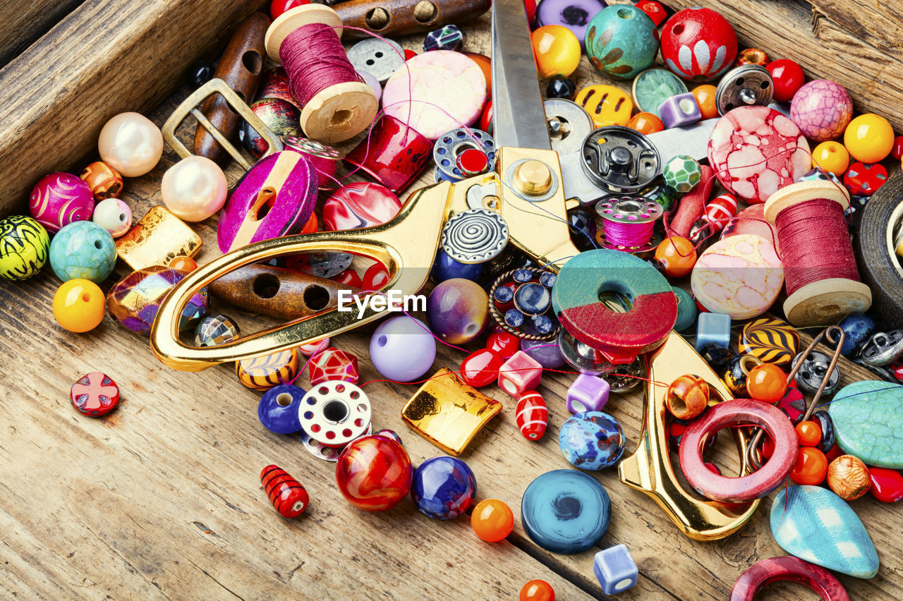 High angle view of various buttons on table