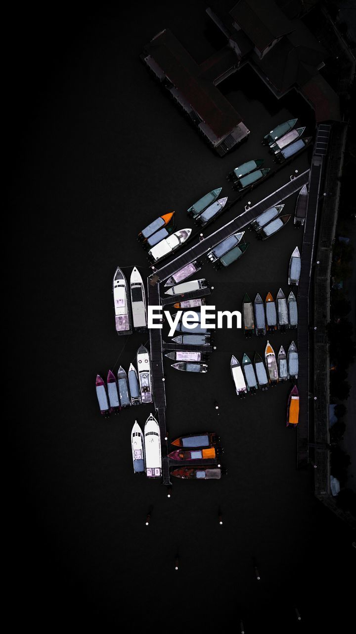 Drone shot of boats moored at harbor