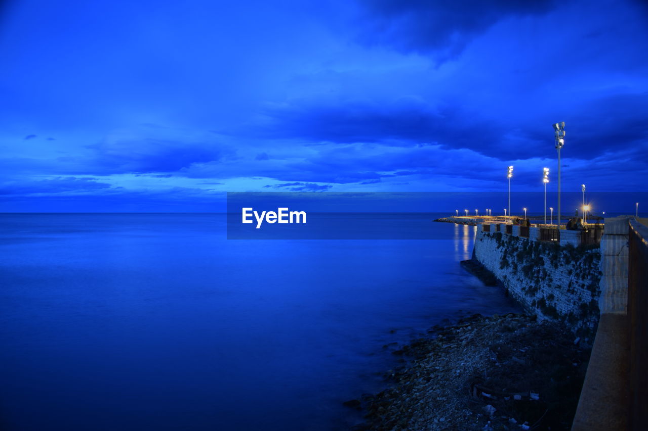 Scenic view of sea against blue sky