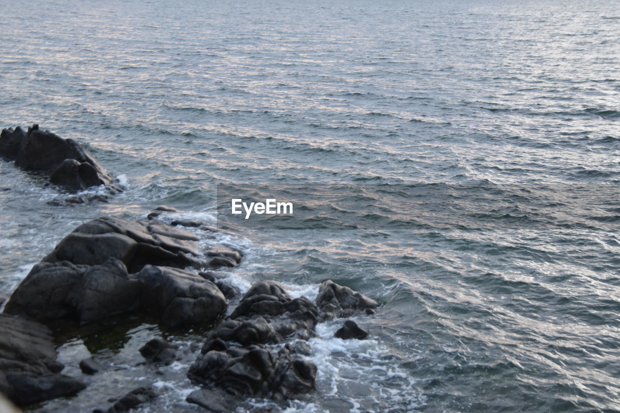 SCENIC VIEW OF ROCKS ON SEA