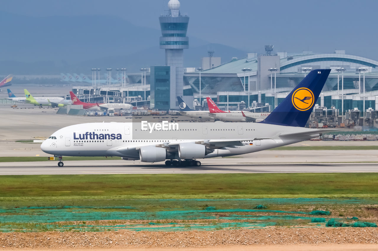 VIEW OF AIRPLANE ON AIRPORT RUNWAY