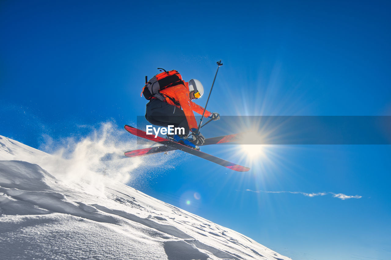 Free-rider skier during a deep snow jump