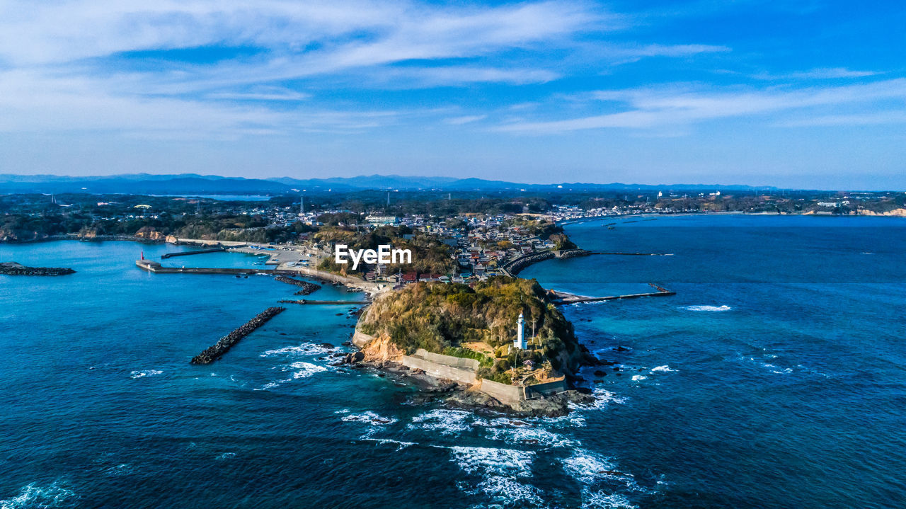 Scenic view of sea and buildings against sky