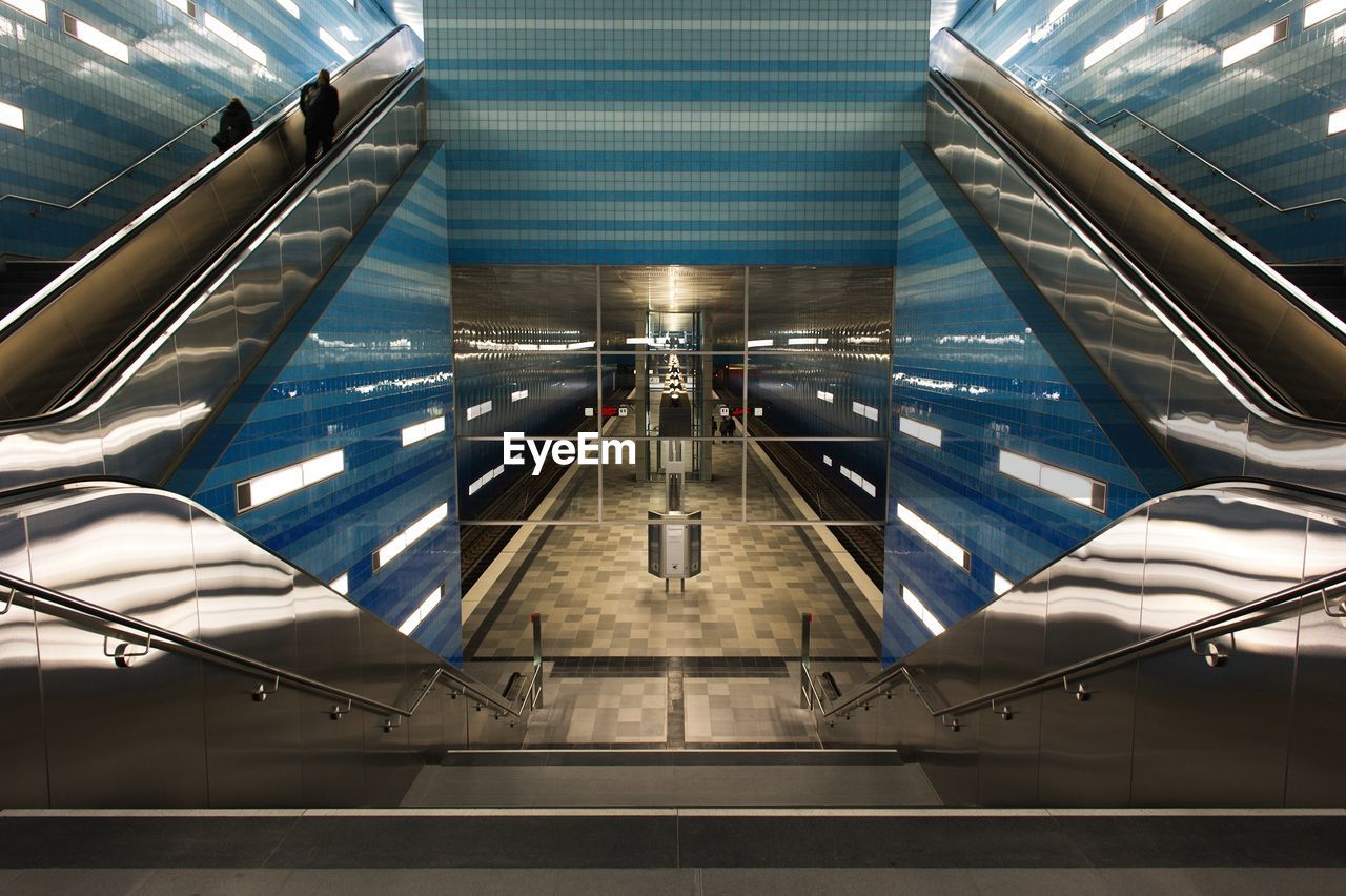 HIGH ANGLE VIEW OF ILLUMINATED SUBWAY STATION