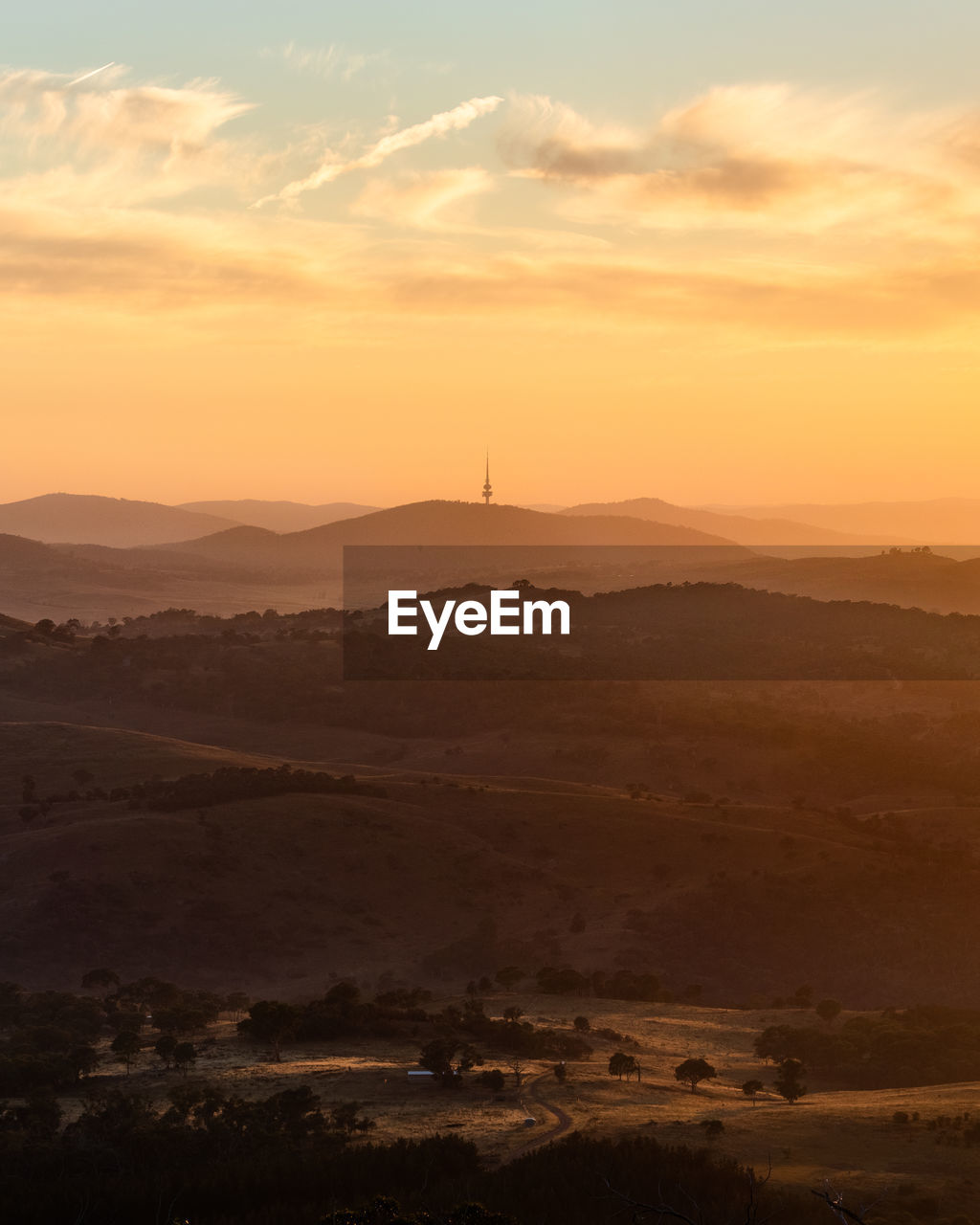 SCENIC VIEW OF SUNSET OVER LANDSCAPE