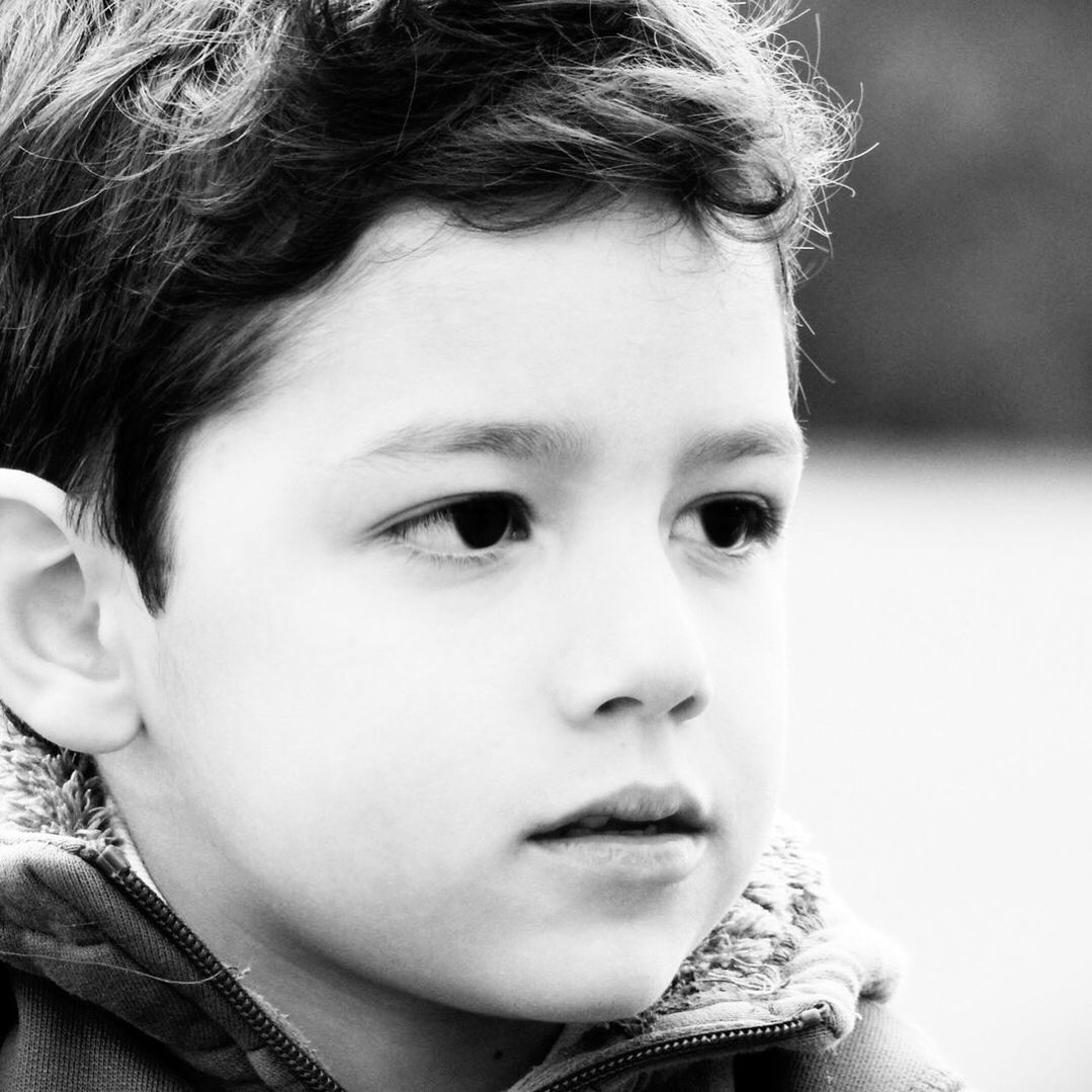 Close-up of boy looking away