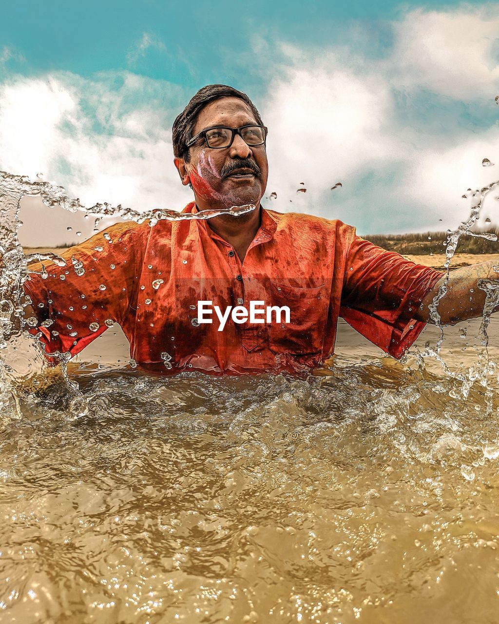 FULL LENGTH PORTRAIT OF MAN ON WATER