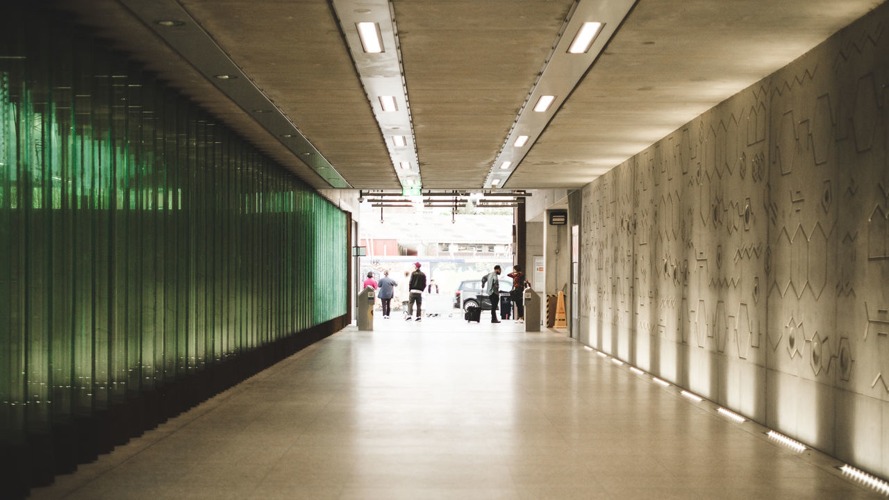 People in corridor of building