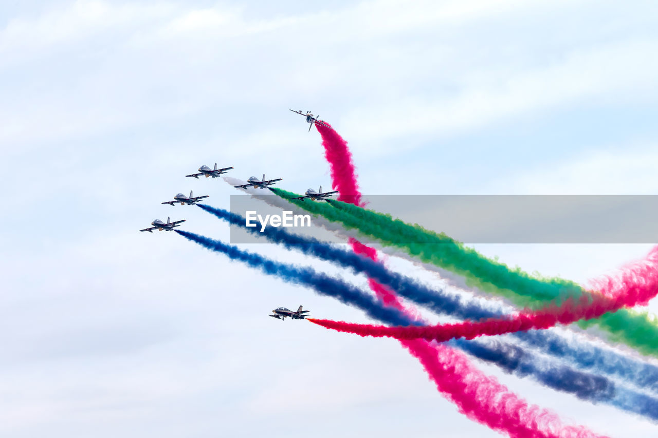 Al fursan aerobatic team doing stunts in the sky in abu dhabi, uae