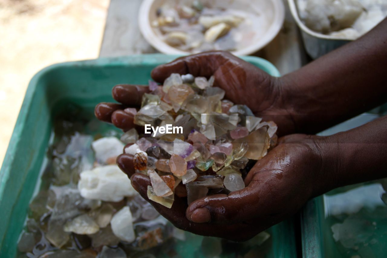 Close-up of hand holding gemstones